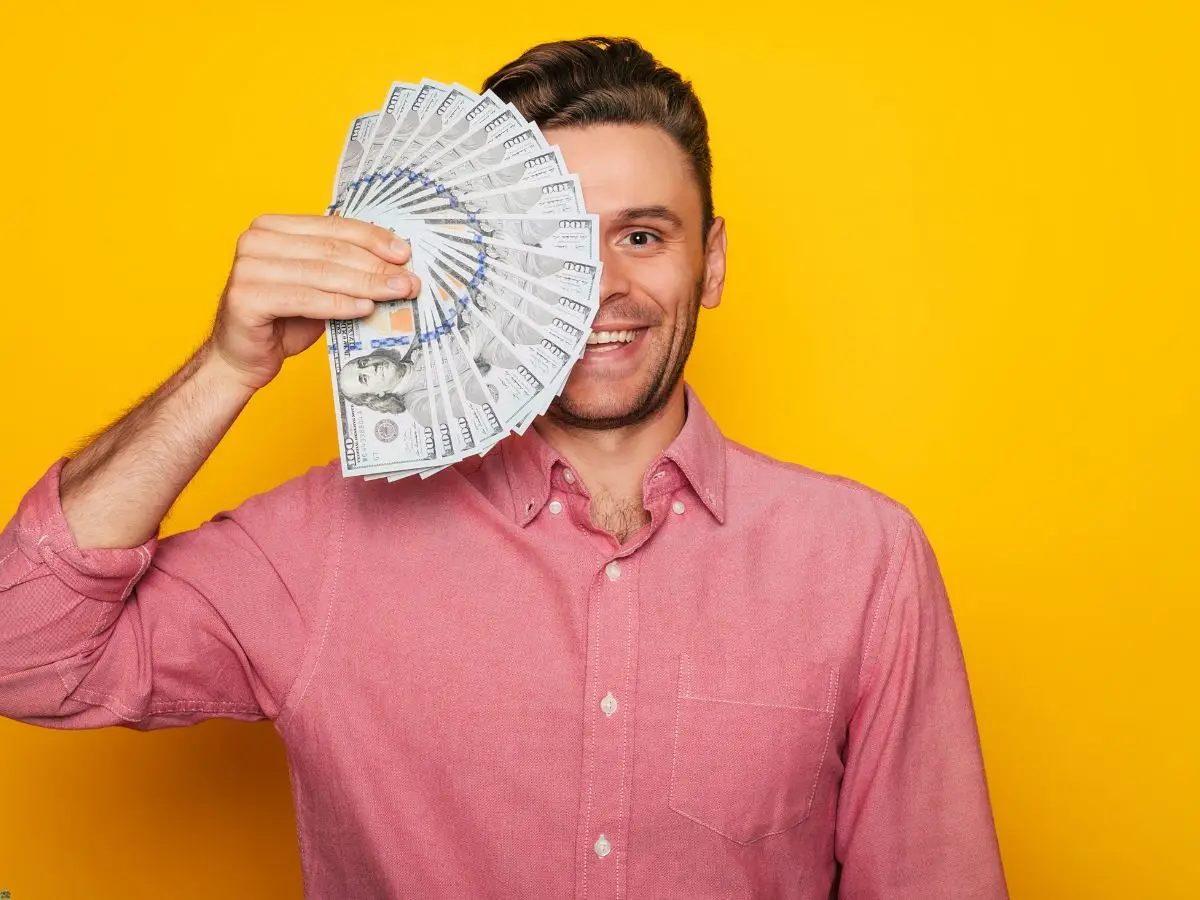 man with a big smile on his face because he just secured an auto registration loan