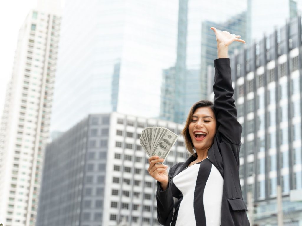 happy woman has cash for rent