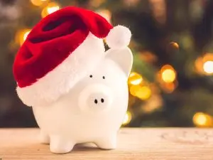 piggy bank with Santa hat represents Christmas budget